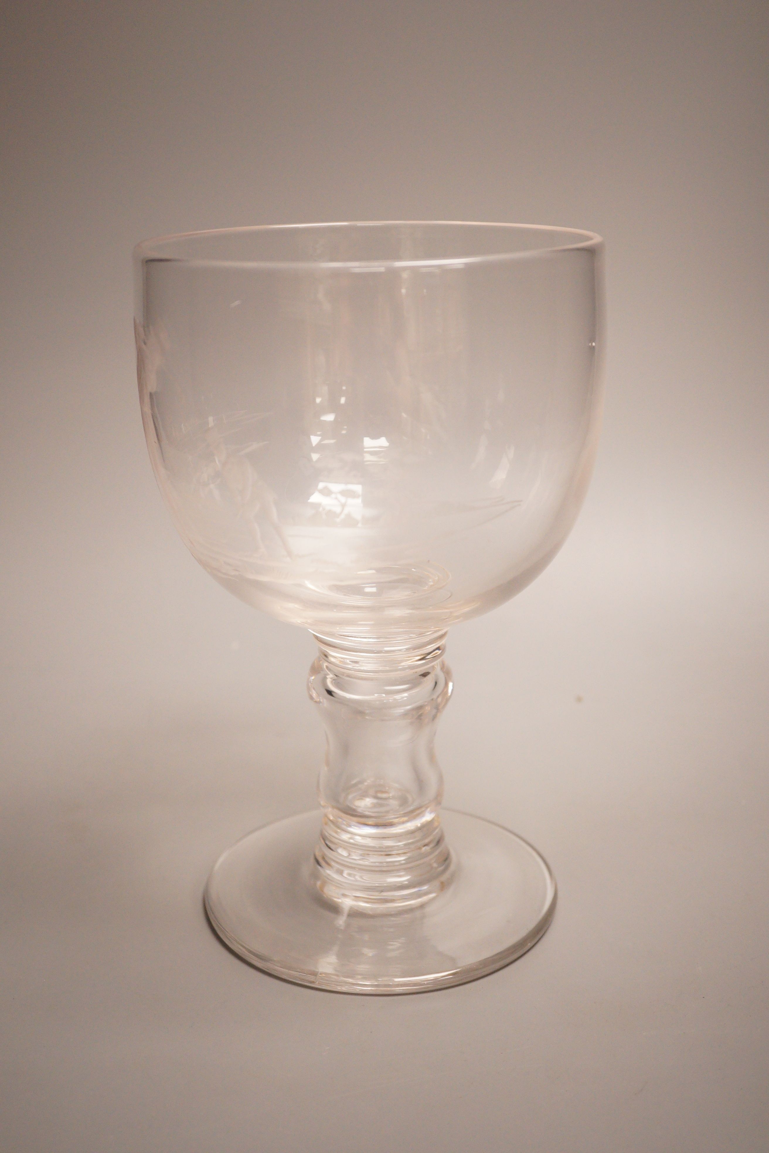 Golfing interest - a Victorian wheel engraved glass goblet, depicting two golfers, height 23cm